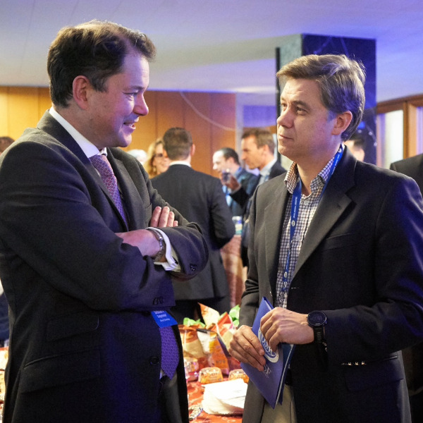 OSAC annual briefing two men talking to each other